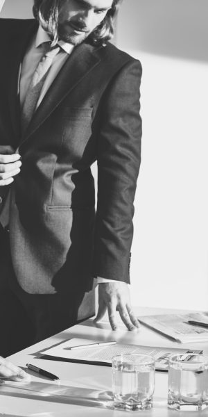 Two elegant businessmen working in office