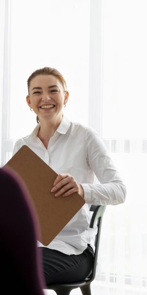 close-up-smiley-therapist-with-patients