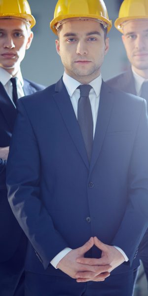 Vertical portrait of a business leader leading his team